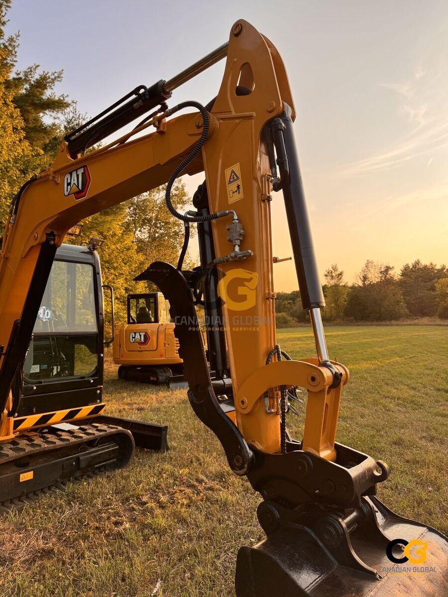 Standard digging bucket with hydraulic thumb — alternate angle
